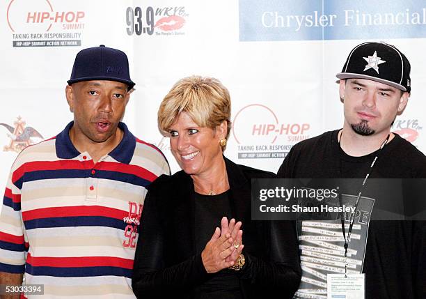 Russell Simmons, Suze Orman and Paul Wall pose backstage before the Hip-Hop Summit on Financial Empowerment held at the Washington Convention Center...