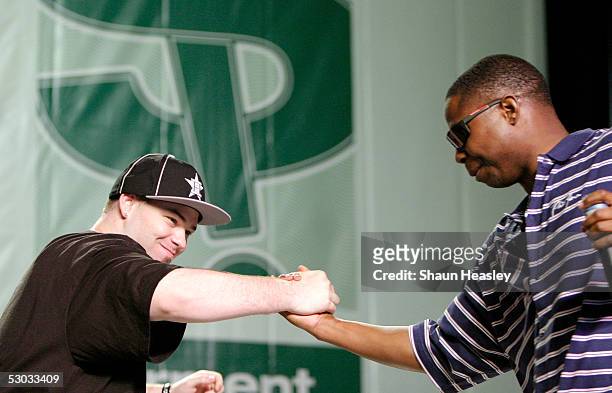 Paul Wall and Doug E. Fresh shake hands during the Hip-Hop Summit on Financial Empowerment held at the Washington Convention Center June 7, 2005 in...