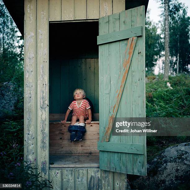 boy in outhouse - child urinating stock pictures, royalty-free photos & images