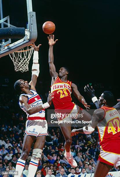 Atlanta Hawks' Dominique Wilkins jumps for a layup against the Washington Bullets during a game at Capital Centre circa 1986 in Washington D.C.. NOTE...