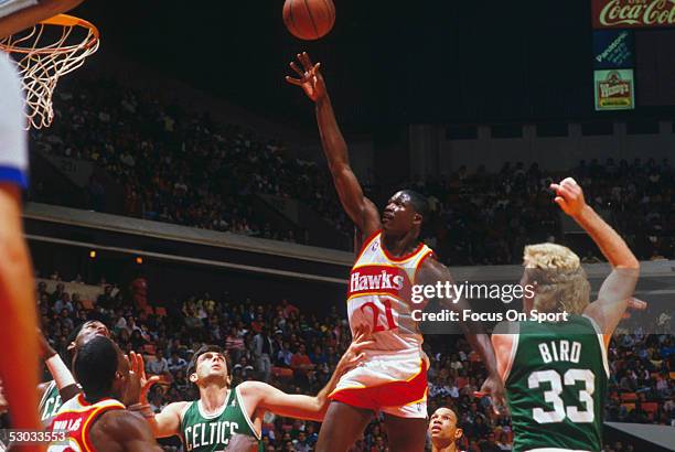 Atlanta Hawks' Dominique Wilkins jumps for a layup against the Boston Celtics. NOTE TO USER: User expressly acknowledges and agrees that, by...