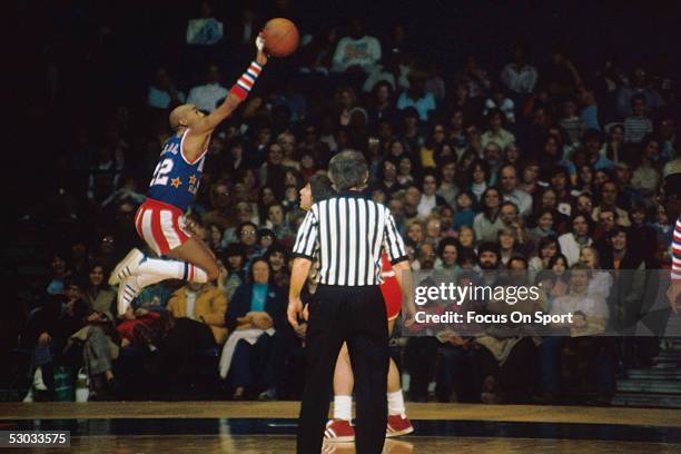 Harlem Globetrotters' Curly Neal makes a jumpshot during a game.