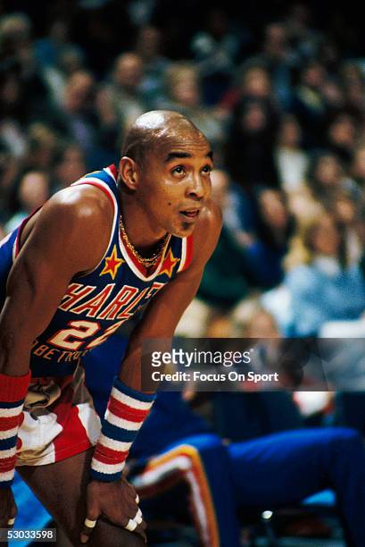 Harlem Globetrotters' Curly Neal takes a break on the court during a game.