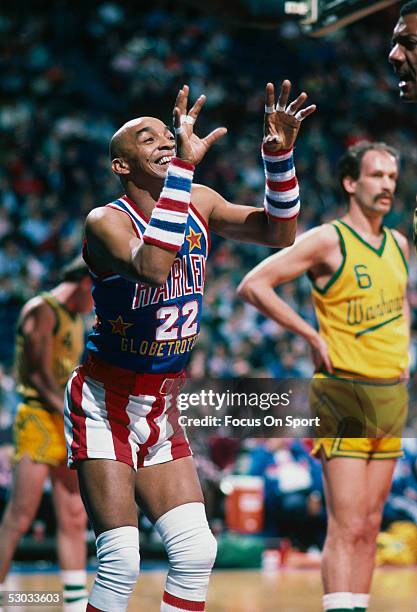 Harlem Globetrotters' Curly Neal makes a show during a game.