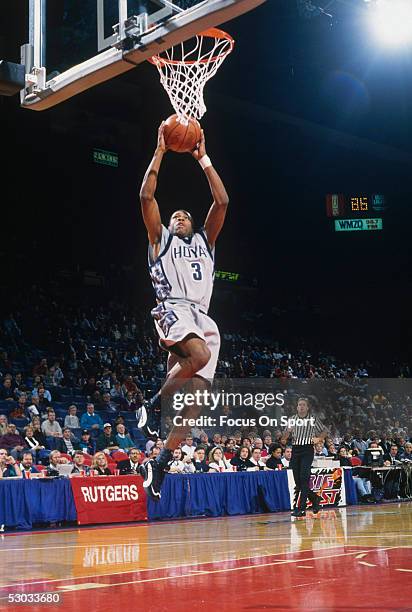 Georgetown Hoyas' Allen Iverson jumps for a layup during a game.