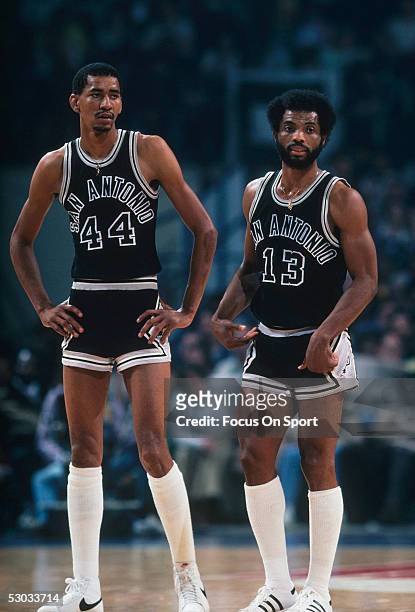 San Antonio Spurs' George Gervin stands next to James Silas on the court during a timeout against the Washington Bullets at Capital Centre circa 1978...