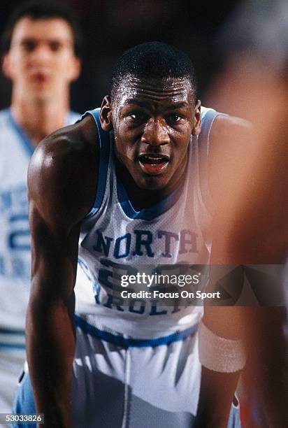 University of North Carolina's Michael Jordan rests for a moment on the court during a game.