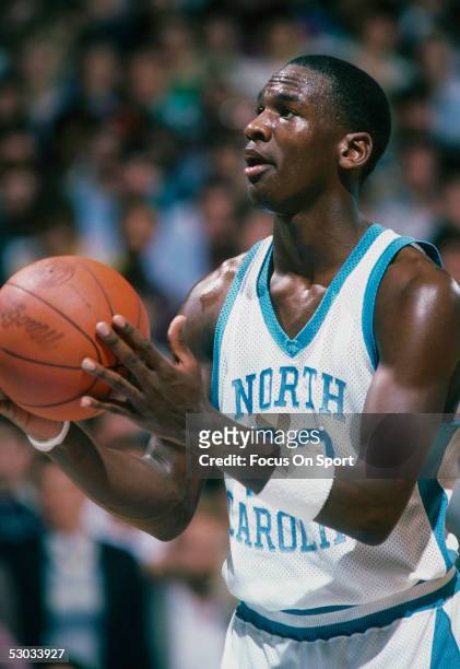 University of North Carolina's Michael Jordan eyes the basket before shooting from the foul line during a game.
