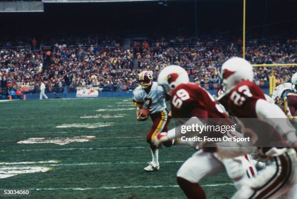 Washington Redskins quarterback Joe Theismann scrambles against the Arizona Cardinals.