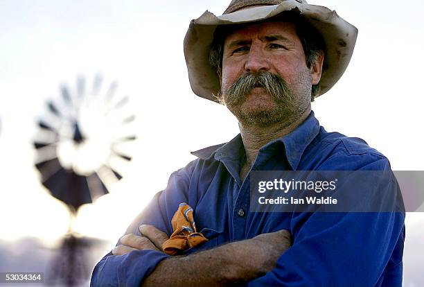Stockman Gordon Litchfield from Wilpoorinna sheep and cattle station stands by a windmill on his property June 7, 2005 in Leigh Creek, Australia....