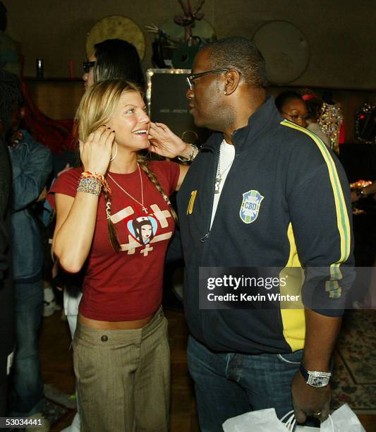 Singer Fergie of the Black Eyed Peas and American Idols' Randy Jackson talk at the Grammy Style Studio 2005 at Ocean Way Recording Studio on February...