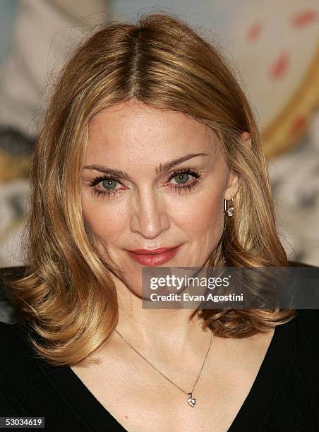 Singer Madonna poses for a photo after reading her latest children's book "Lotsa de Casha" to children from Public School 191 at Borders Bookstore...