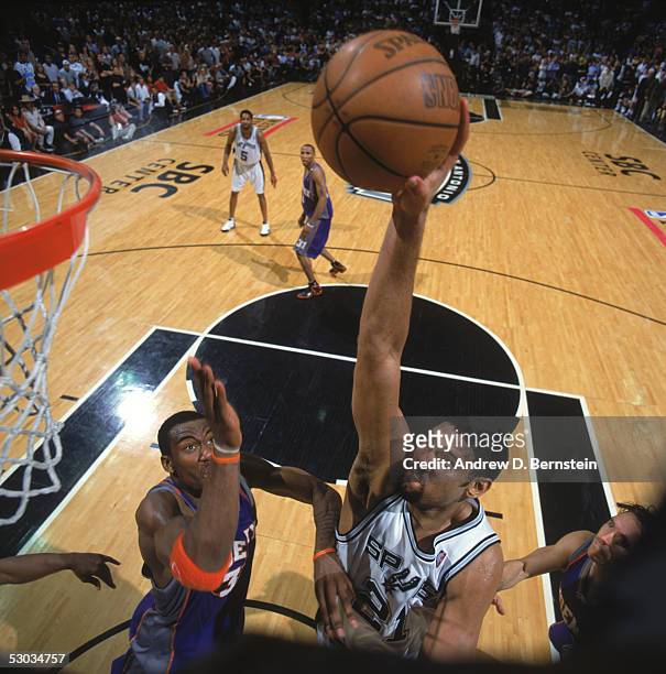 Tim Duncan of the San Antonio Spurs goes for a layup against Amare Stoudemire of the Phoenix Suns in Game four of the Western Conference Finals...