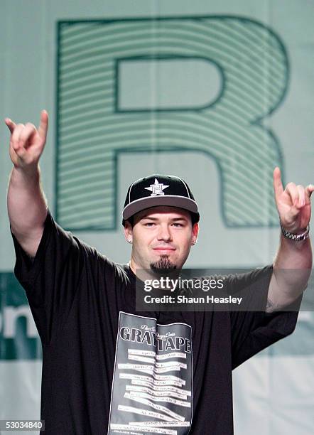 Paul Wall gestures while making his way on stage to speak at the Hip-Hop Summit on Financial Empowerment held at the Washington Convention Center...