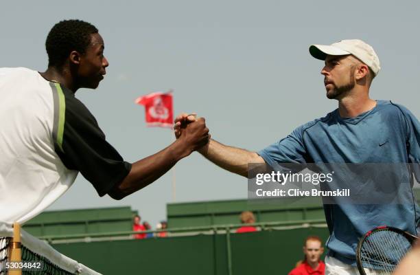 Jamie Delgado of Great Britan shakes hands after winning his first round match against Gael Monfils of France at the Stella Artois Tennis...