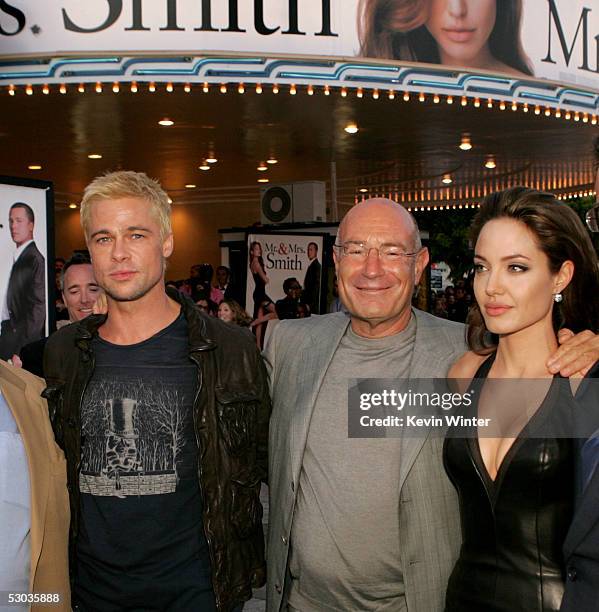 Actor Brad Pitt, Producer Arnon Milchan and actress Angelina Jolie arrive at the premiere of "Mr. & Mrs. Smith" at the Mann Village Theater on June...