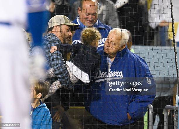 Tommy Lasorda kisses Jane Kimmel as Jimmy Kimmel holds her at a baseball game between the New York Mets and the Los Angeles Dodgers at Dodger Stadium...