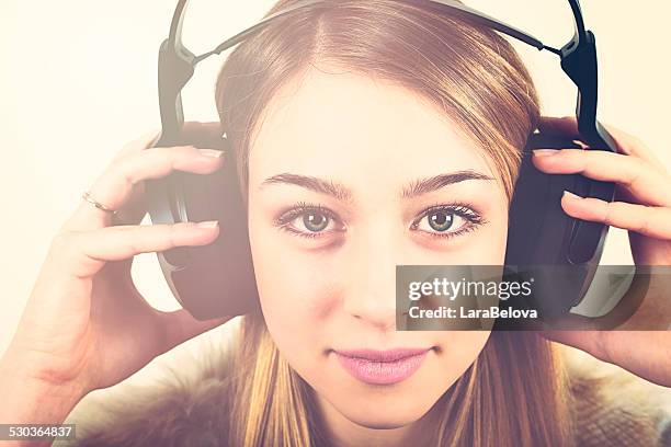 beautiful young woman with headphones - green eyes stock pictures, royalty-free photos & images