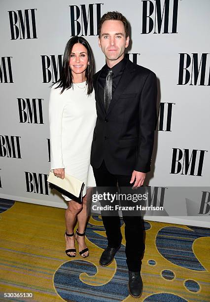 Actress Courteney Cox and musician Johnny McDaid of Snow Patrol attend The 64th Annual BMI Pop Awards, honoring Taylor Swift and songwriting duo Mann...