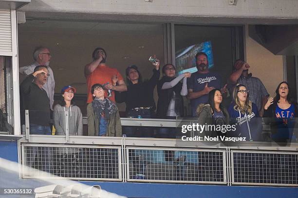 Tom Hanks , Gary Goetzman, Nia Vardalos , Suzy Nakamura, and guests attend a baseball game between the New York Mets and the Los Angeles Dodgers at...