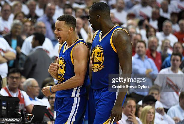 Stephen Curry of the Golden State Warriors celebrates after hitting a shot during overtime of Game Four of the Western Conference Semifinals against...