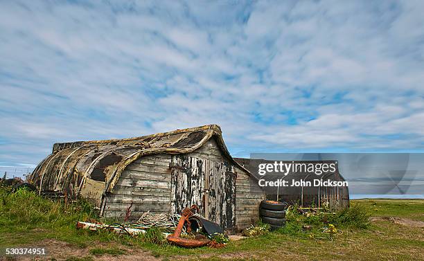 upturned boat sheds. - holy island northumberland stock pictures, royalty-free photos & images