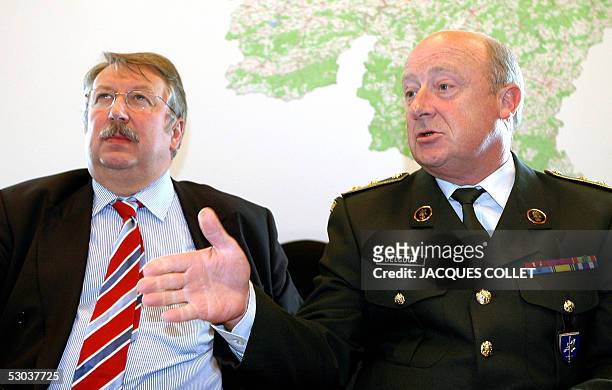 Belgian General Charles-Henri Delcour gives a joint press conference with Defence Minister Andre Flahaut , 08 June 2005, in Brussels. General Delcour...