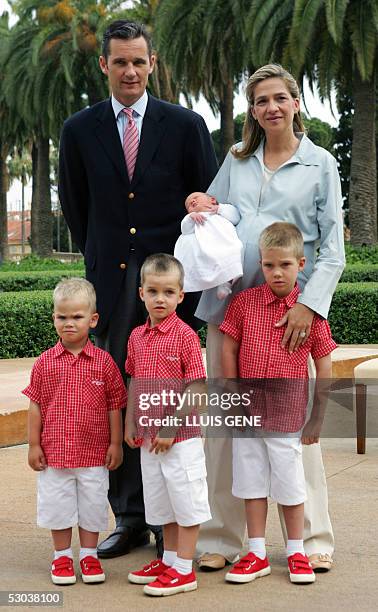 The Duke and Duchess of Palma Princess Cristina and her husband Inaki Urdangarin smile during the official presentation of their newborn daughter...