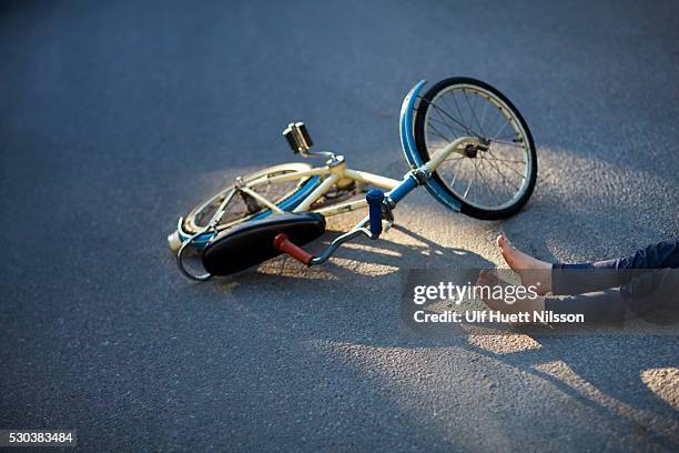 child with bicycle fallen on street - lower bildbanksfoton och bilder