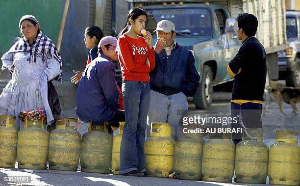 Bolivians line up in the hope of being able to purchase home gas 08 June, 2005 in La Paz. Indigenous protesters demanding the nationalization of the...