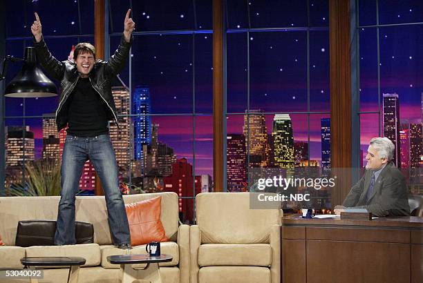 In this handout photo provided by NBC, actor Tom Cruise stands on the couch during an interview on "The Tonight Show with Jay Leno" June 8, 2005 in...