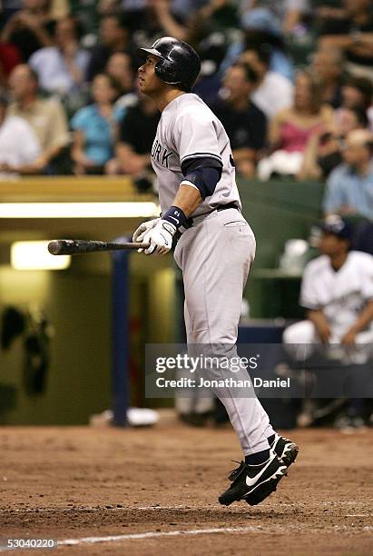 Alex Rodriguez of the New York Yankees hops after hitting his 400th career home run, a solo shot in the eighth inning, against the Milwaukee Brewers...