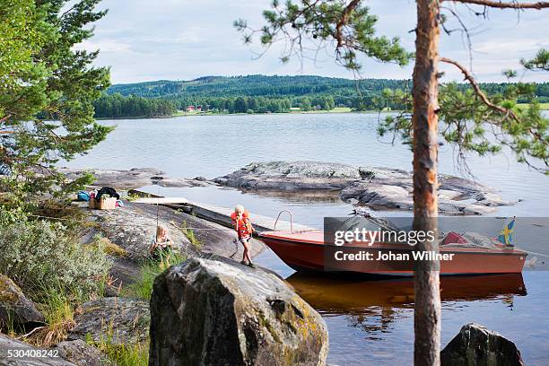 children near boat, siljan, dalarna, sweden - dalarna stock pictures, royalty-free photos & images