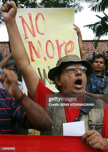 Sri Lankan left wing leader Vickremabahu Karunaratne shouts slogans as he joins others in a demonstration in the suburb of Maharagama in Colombo, 09...