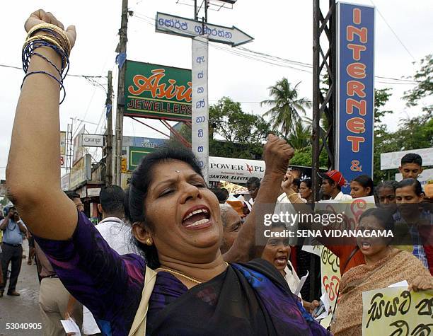 Sri Lankan left wing activists shout slogans as they take part in a demonstration in the suburb of Maharagama in Colombo, 09 June 2005. The...