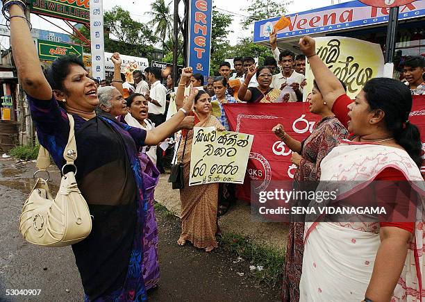 Sri Lankan left wing activists shout slogans as they take part in a demonstration in the suburb of Maharagama in Colombo, 09 June 2005. The...
