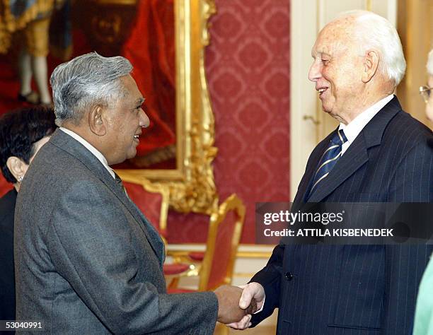 Singapore's President S. R. Nathan is welcomed by his Hunagrian counterpart Ferenc Madl in the Red Hall of the presidental palace of Budapest Castle...