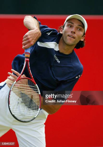 Ivo Karlovic of Croatia serves during his third round match against Tomas Zib of Czech Republic at the Stella Artois Tennis Championships at the...
