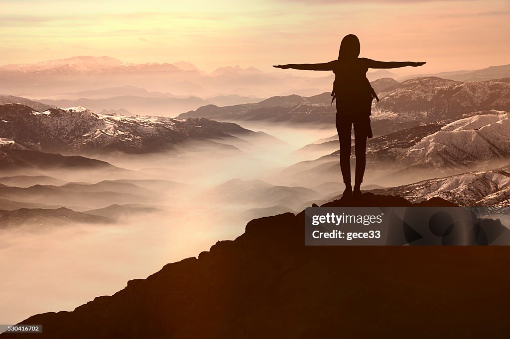 Woman Silhouette at sunset  on hill