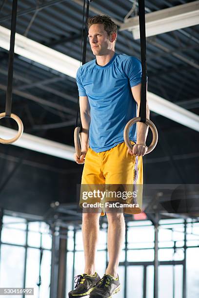 working on balance - white spandex shorts stockfoto's en -beelden