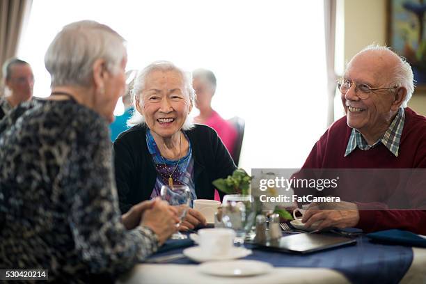 lunch in a nursing home - retirement community stock pictures, royalty-free photos & images