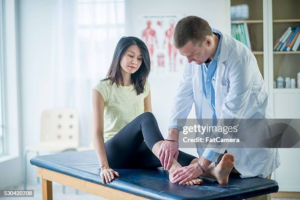 ankle injury - examination table stock pictures, royalty-free photos & images