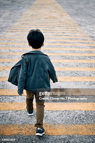 the boy walked zebra lines. - the runaways photos et images de collection