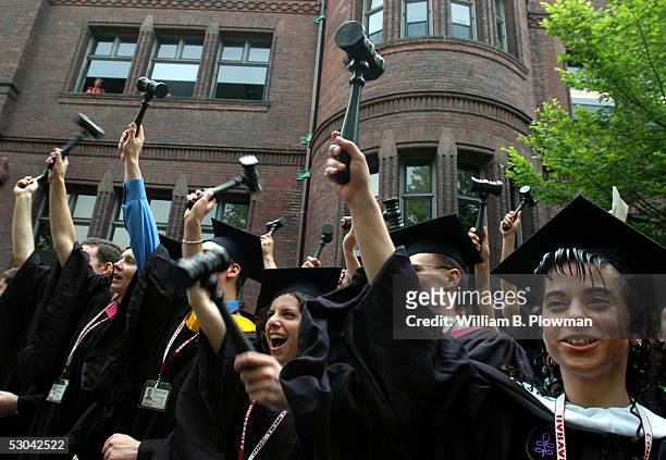 Harvard Law School graduates celebrate by waving gavels during Harvard University Commencement exercises in June 9, 2005 in Cambridge, Massachusetts.