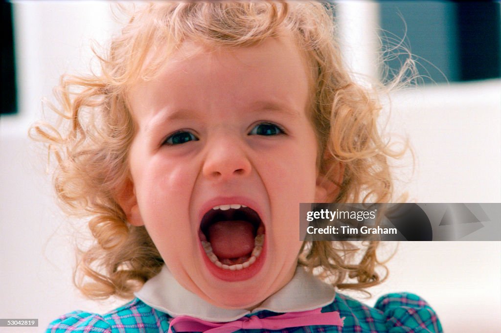 A two year old girl shouting