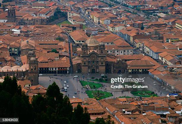 Young people gather in Plaza de Armas square by the fountain in Cuzco, the ancient capital of the Inca Empire, Peru, South America.