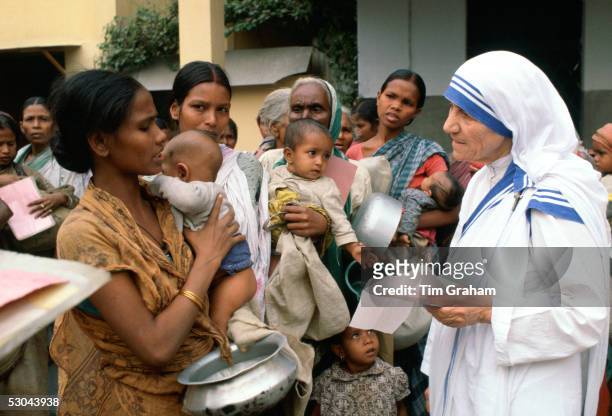 Mother Teresa with mothers and children at her Mission in Calcutta, India.
