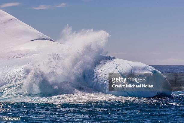 waves washing over iceberg near elephant island, south shetland islands, antarctica, polar regions - elephant island south shetland islands stockfoto's en -beelden