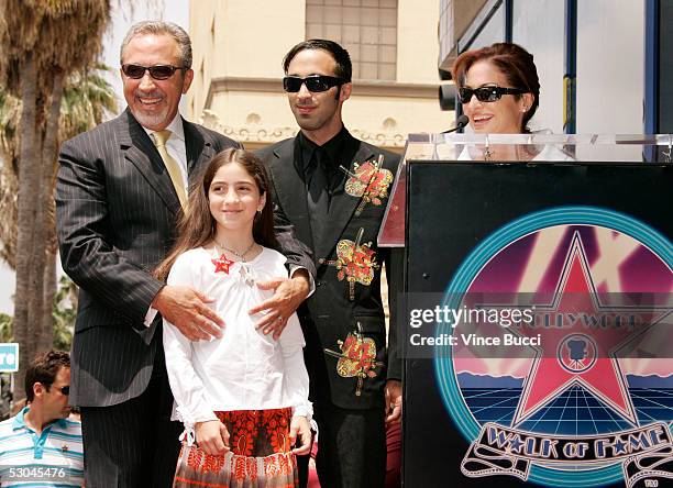 Music producer Emilio Estefan poses with his daughter Emily, son Nayib and wife Gloria at the ceremony honoring him with a star on the Hollywood Walk...