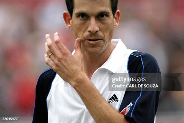 British player Tim Henman walks off after beating Australian Chris Guccione at Queens Tennis club on the fourth day of the Stella Artois Tennis...